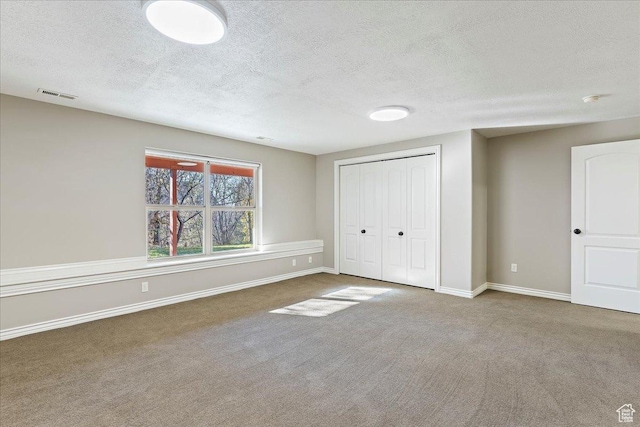 1711 N Compton Rd, Farmington, UT 84025 - unfurnished bedroom featuring a textured ceiling, carpet floors, and a closet