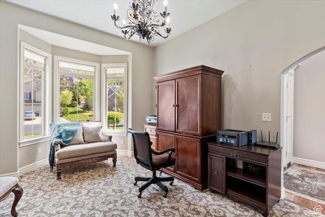 1711 N Compton Rd, Farmington, UT 84025 - home office with arched walkways, a chandelier, and light colored carpet