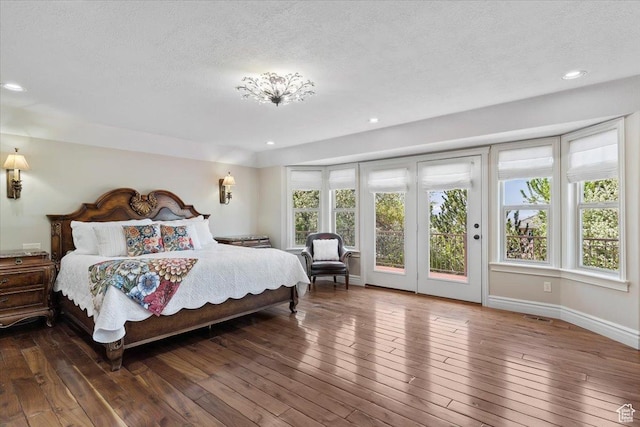1711 N Compton Rd, Farmington, UT 84025 - bedroom featuring access to exterior, hardwood / wood-style flooring, a textured ceiling, and recessed lighting