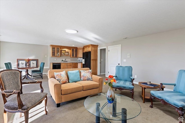 1711 N Compton Rd, Farmington, UT 84025 - living area with light colored carpet, wine cooler, and a textured ceiling