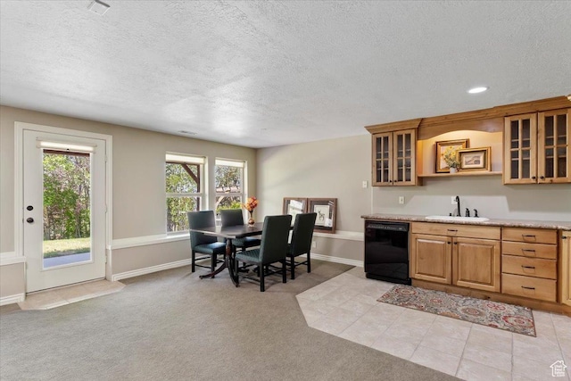 1711 N Compton Rd, Farmington, UT 84025 - kitchen with dishwasher, a textured ceiling, light countertops, glass insert cabinets, and light colored carpet