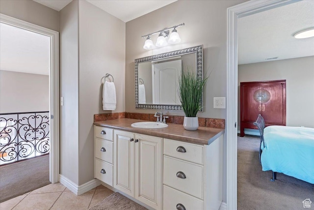 1711 N Compton Rd, Farmington, UT 84025 - bathroom with connected bathroom, vanity, and tile patterned floors