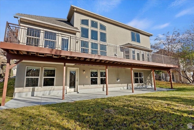 1711 N Compton Rd, Farmington, UT 84025 - back of house featuring a patio area, stucco siding, a lawn, and a deck