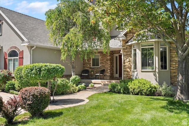 1711 N Compton Rd, Farmington, UT 84025 - view of front of property with stucco siding, stone siding, and a front yard