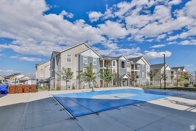 4234 W Mckellen Dr S Unit G301, Herriman, UT 84096 - view of basketball court with a residential view and a community pool