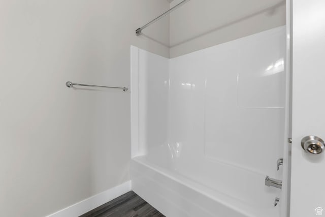 4234 W Mckellen Dr S Unit G301, Herriman, UT 84096 - bathroom featuring shower / washtub combination and wood finished floors