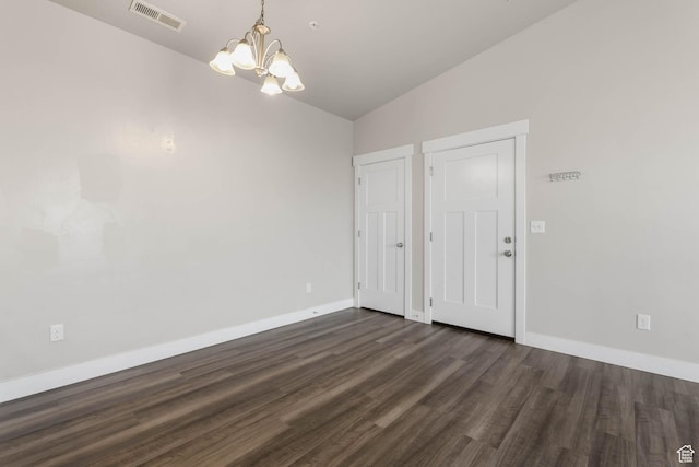 4234 W Mckellen Dr S Unit G301, Herriman, UT 84096 - unfurnished dining area with a chandelier, lofted ceiling, and dark wood-style flooring