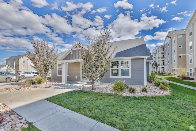 4234 W Mckellen Dr S Unit G301, Herriman, UT 84096 - view of front facade with a front lawn, board and batten siding, and a residential view
