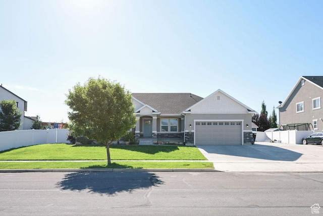 1090 E 770 S, Heber City, UT 84032 - view of front facade featuring a garage, concrete driveway, and stone siding