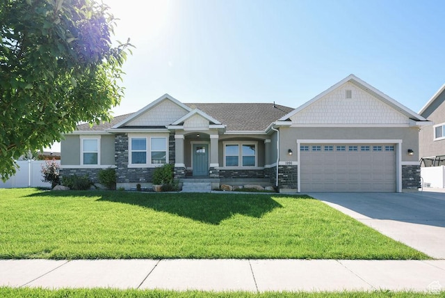 1090 E 770 S, Heber City, UT 84032 - craftsman house featuring stone siding, a garage, concrete driveway, and stucco siding