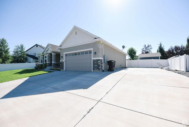 1090 E 770 S, Heber City, UT 84032 - view of home's exterior featuring driveway, an attached garage, stone siding, and stucco siding