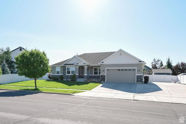 1090 E 770 S, Heber City, UT 84032 - craftsman-style house with an attached garage, concrete driveway, and stone siding