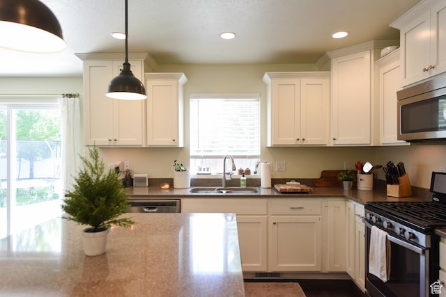 1090 E 770 S, Heber City, UT 84032 - kitchen with stainless steel appliances, white cabinets, recessed lighting, and decorative light fixtures