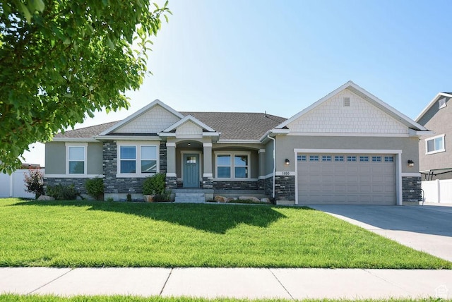 1090 E 770 S, Heber City, UT 84032 - craftsman-style house with stone siding, an attached garage, concrete driveway, and stucco siding