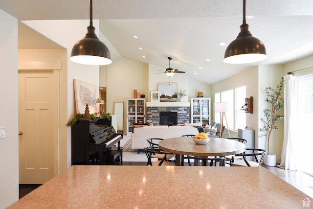 1090 E 770 S, Heber City, UT 84032 - dining area featuring a fireplace, a ceiling fan, and lofted ceiling