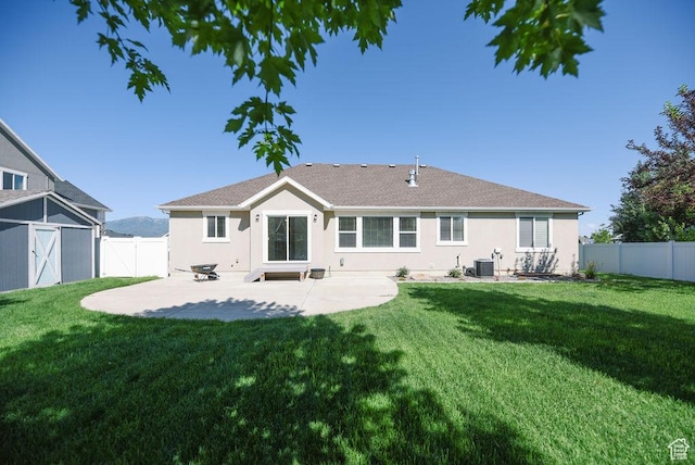 1090 E 770 S, Heber City, UT 84032 - rear view of property featuring a patio area, stucco siding, a fenced backyard, roof with shingles, and a gate