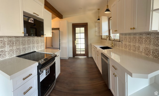 380 N K St, Salt Lake City, UT 84103 - kitchen featuring appliances with stainless steel finishes, decorative backsplash, dark wood-style floors, and white cabinets