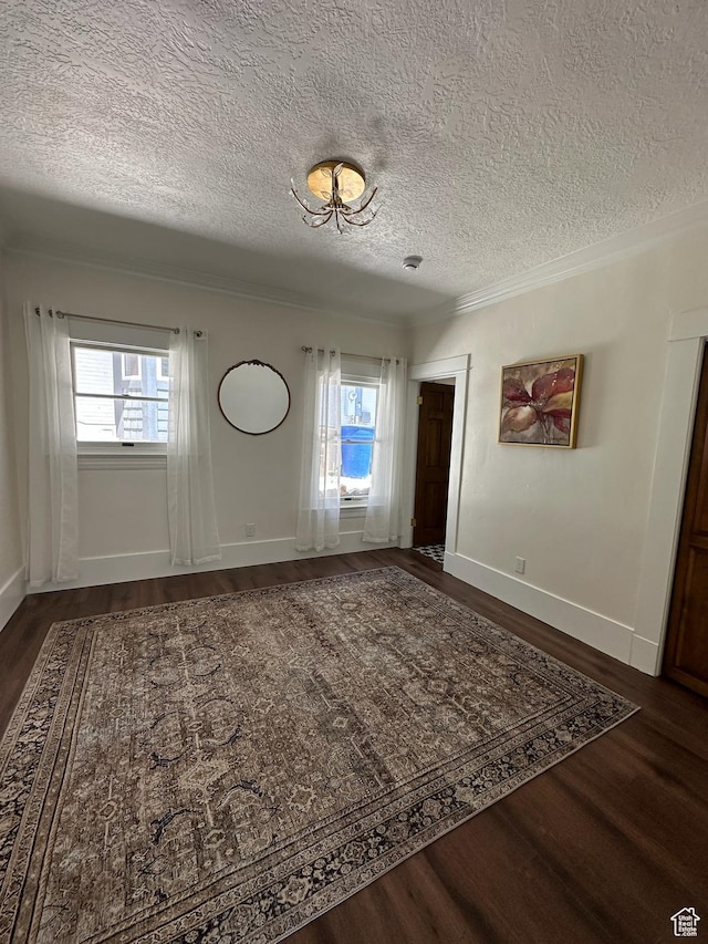 380 N K St, Salt Lake City, UT 84103 - entrance foyer featuring a textured ceiling, dark wood-style floors, plenty of natural light, and ornamental molding
