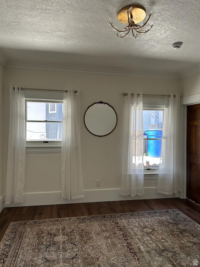 380 N K St, Salt Lake City, UT 84103 - unfurnished room featuring ornamental molding, dark wood-style floors, a textured ceiling, and a smoke detector