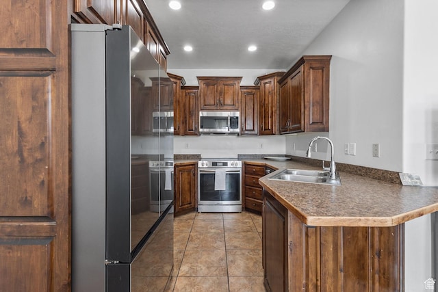 108 S 610 E, American Fork, UT 84003 - kitchen featuring stainless steel appliances, a peninsula, recessed lighting, dark countertops, and light tile patterned flooring
