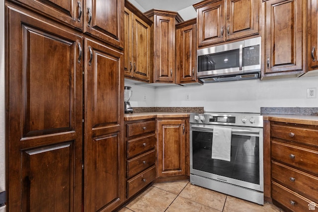 108 S 610 E, American Fork, UT 84003 - kitchen with stainless steel appliances and light tile patterned flooring