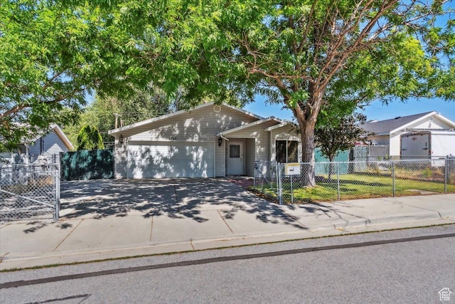 2793 S Cyprus Grove Cir W, Magna, UT 84044 - ranch-style house featuring concrete driveway, an attached garage, and a fenced front yard