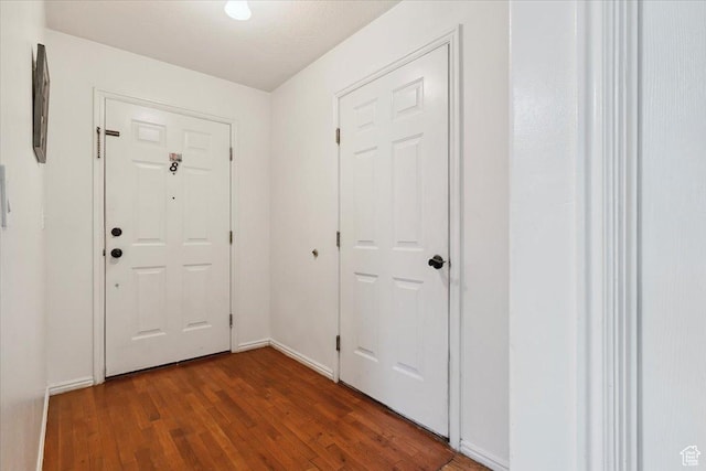 2793 S Cyprus Grove Cir W, Magna, UT 84044 - entryway with wood finished floors and baseboards