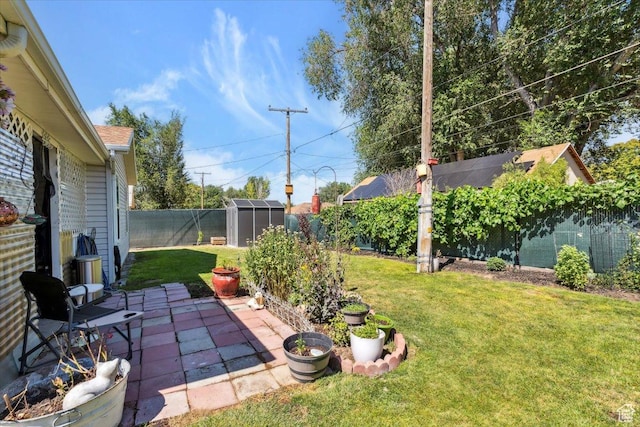 2793 S Cyprus Grove Cir W, Magna, UT 84044 - fenced backyard with a storage unit and a patio area
