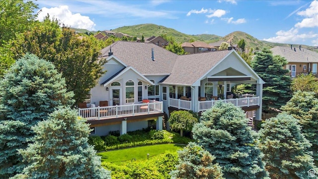 1677 E Wylie Ln, Draper, UT 84020 - back of property featuring a shingled roof and a deck with mountain view