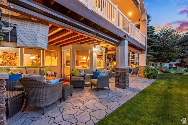 1677 E Wylie Ln, Draper, UT 84020 - patio terrace at dusk featuring a balcony, outdoor lounge area, a patio, and a lawn
