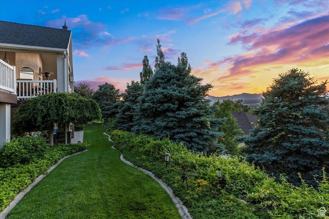 1677 E Wylie Ln, Draper, UT 84020 - yard at dusk with a balcony and a lawn