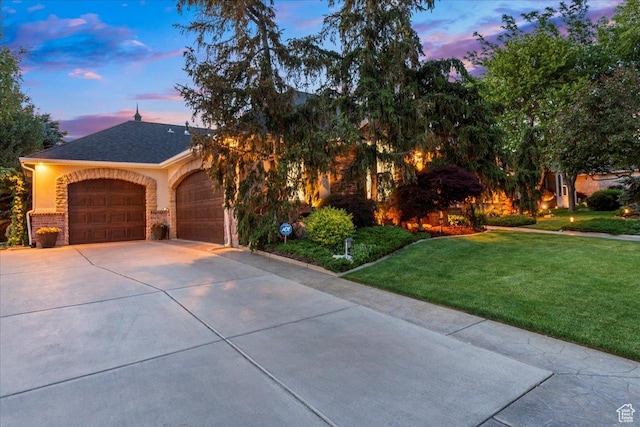 1677 E Wylie Ln, Draper, UT 84020 - view of front facade featuring a yard, driveway, and a garage
