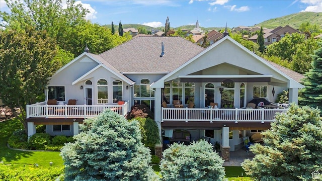 1677 E Wylie Ln, Draper, UT 84020 - rear view of property featuring a shingled roof, a wooden deck, and stucco siding