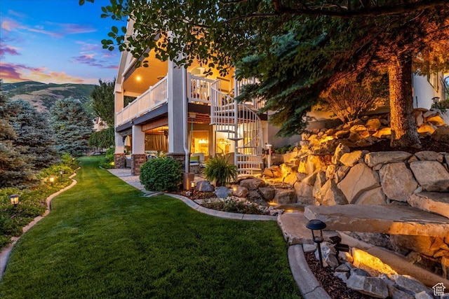 1677 E Wylie Ln, Draper, UT 84020 - view of side of home featuring stairs, a yard, and stone siding