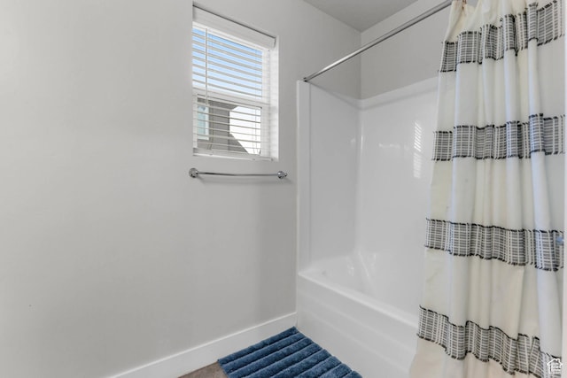 499 N Stone Ridge Dr, Saratoga Springs, UT 84045 - full bath with baseboards and shower / bathtub combination with curtain