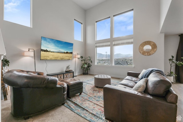 499 N Stone Ridge Dr, Saratoga Springs, UT 84045 - carpeted living room featuring a high ceiling and baseboards