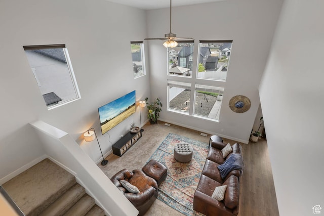 499 N Stone Ridge Dr, Saratoga Springs, UT 84045 - living area featuring stairway, ceiling fan, and wood finished floors