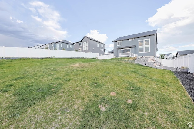 499 N Stone Ridge Dr, Saratoga Springs, UT 84045 - rear view of property featuring a fenced backyard and stucco siding