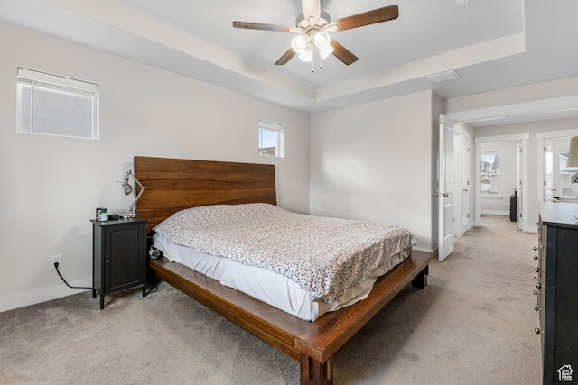 499 N Stone Ridge Dr, Saratoga Springs, UT 84045 - bedroom featuring light carpet, a tray ceiling, and ceiling fan