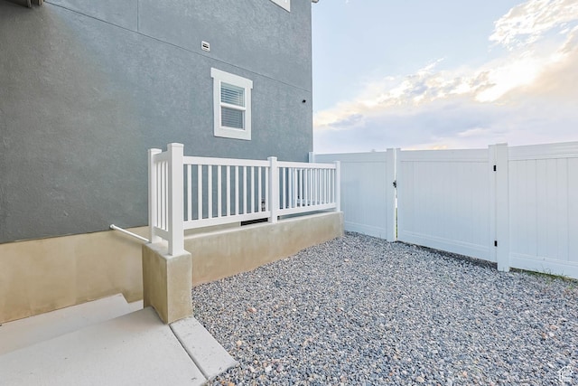 499 N Stone Ridge Dr, Saratoga Springs, UT 84045 - view of side of home with a gate and stucco siding