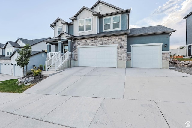 499 N Stone Ridge Dr, Saratoga Springs, UT 84045 - craftsman-style home with stone siding, board and batten siding, driveway, and a garage