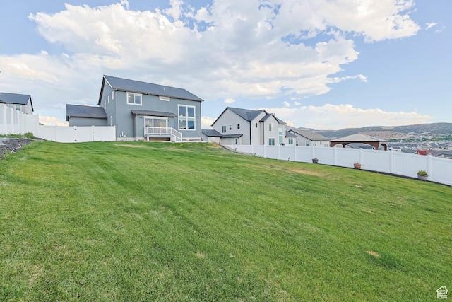 499 N Stone Ridge Dr, Saratoga Springs, UT 84045 - back of property with a fenced backyard and stucco siding