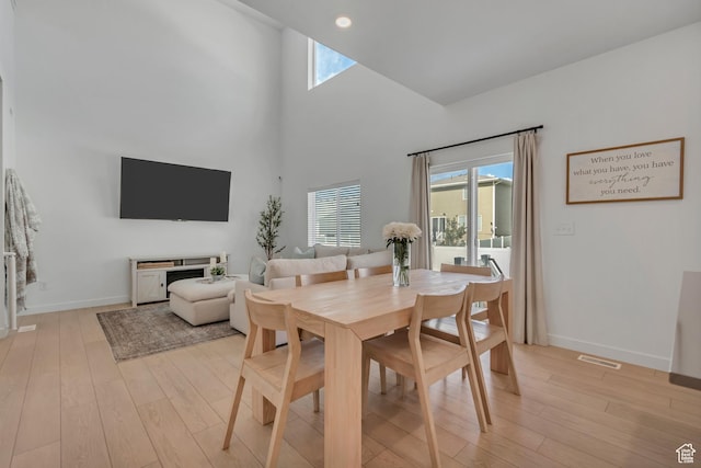 3444 Sparrow Ln W Unit 164, Eagle Mountain, UT 84005 - dining space with light wood finished floors, healthy amount of natural light, a high ceiling, and recessed lighting