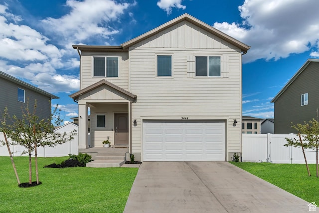 3444 Sparrow Ln W Unit 164, Eagle Mountain, UT 84005 - view of front of house with a garage, board and batten siding, and concrete driveway
