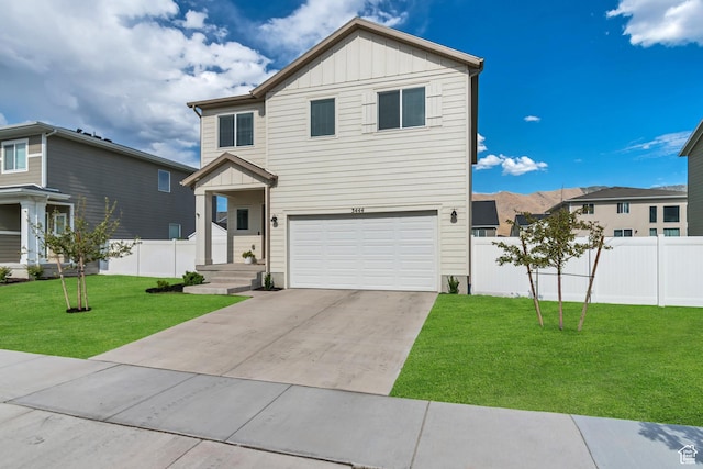 3444 Sparrow Ln W Unit 164, Eagle Mountain, UT 84005 - view of front of home with board and batten siding, driveway, and an attached garage