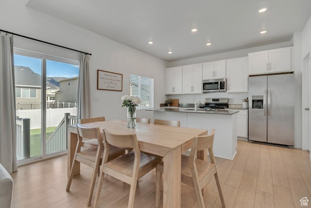 3444 Sparrow Ln W Unit 164, Eagle Mountain, UT 84005 - kitchen featuring appliances with stainless steel finishes, plenty of natural light, light wood finished floors, white cabinets, and recessed lighting