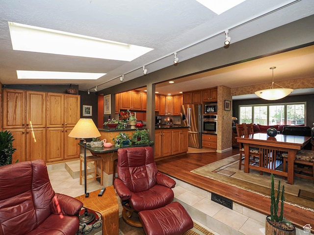 2680 E 2100th St S Unit 44-45, Salt Lake City, UT 84109 - living area with track lighting and light tile patterned floors