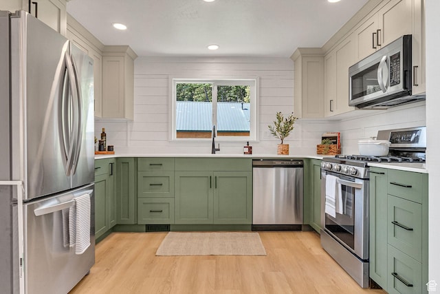 575 Upper Evergreen Dr, Park City, UT 84098 - kitchen featuring green cabinets, appliances with stainless steel finishes, light wood-type flooring, light countertops, and recessed lighting