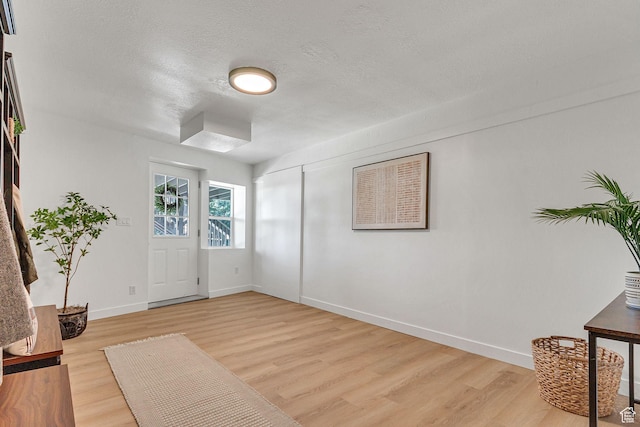 575 Upper Evergreen Dr, Park City, UT 84098 - entrance foyer with light wood-type flooring and a textured ceiling