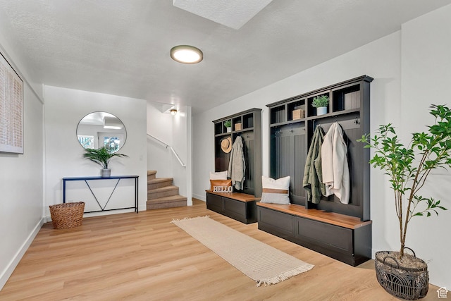 575 Upper Evergreen Dr, Park City, UT 84098 - mudroom featuring light wood-style floors, a textured ceiling, and built in shelves